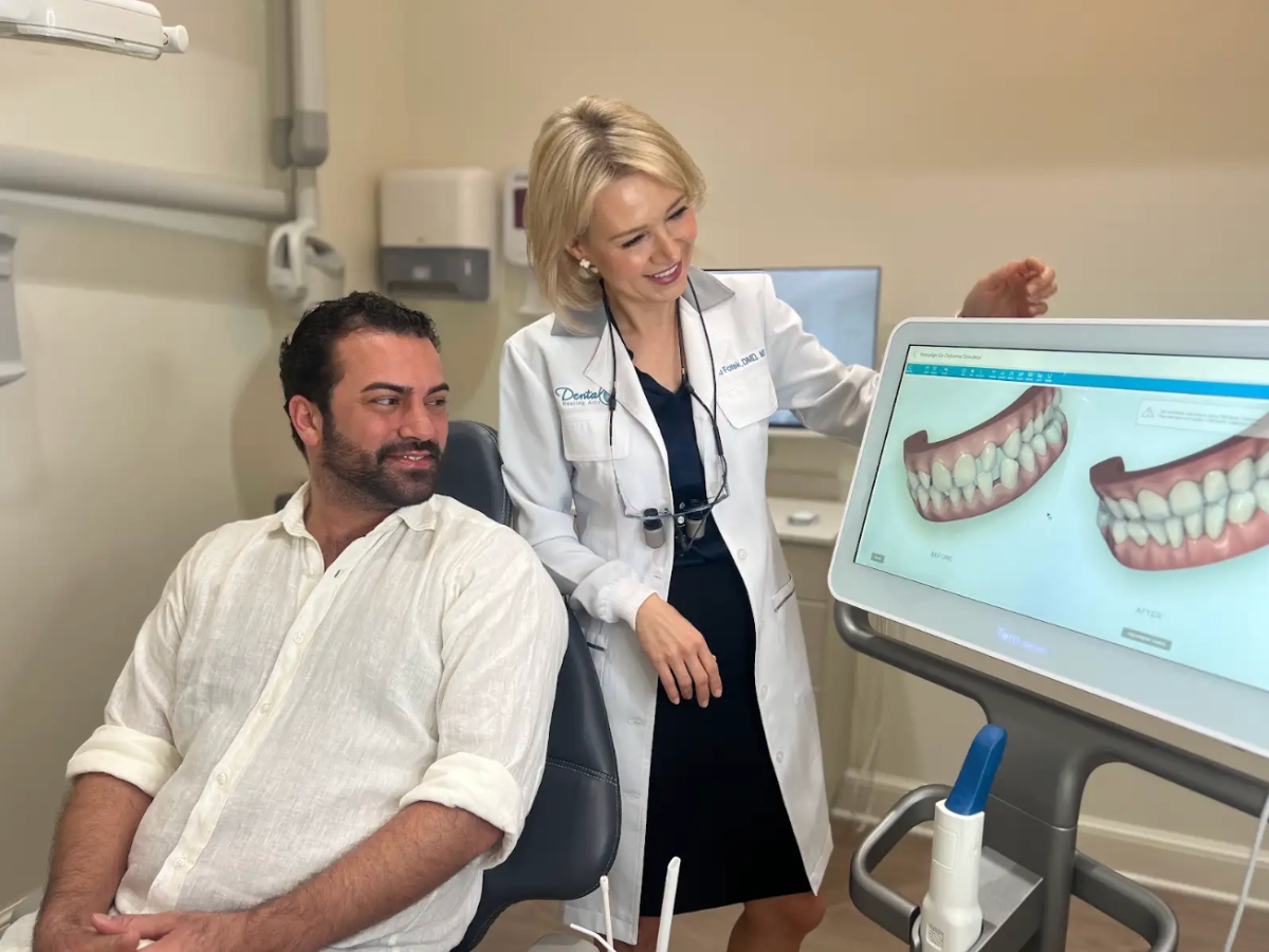 Dentist Discussing Treatment With Anxious Patient