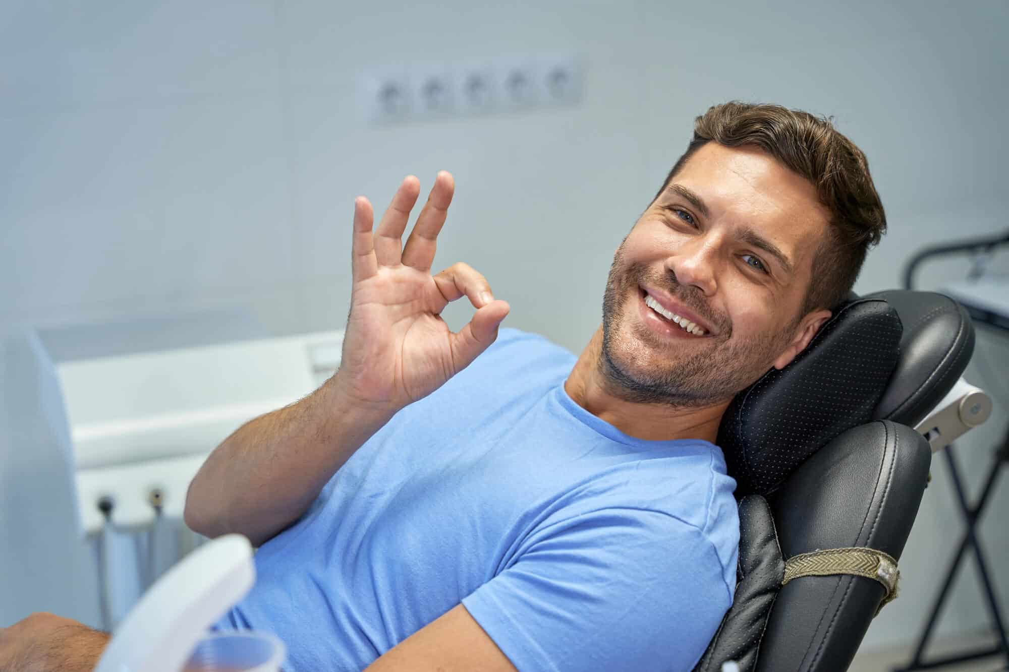 Dental patient giving an OK sign after sleep apnea care