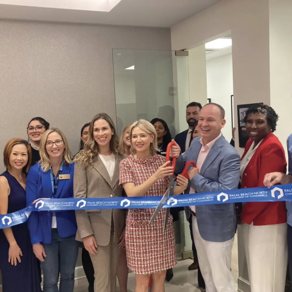 Dr. Ilona Fotek and Dr. Paul Fotek during a Chamber of Commerce ribbon-cutting grand opening event